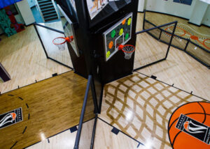 A basketball court with basketballs on it.