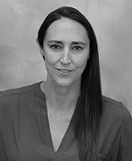 A black and white photo of a woman with long hair.