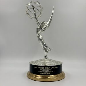 The emmy award trophy, a symbol of excellence in television, is shown on a white background.