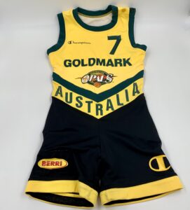 An australian basketball uniform with the word goldmark on it, celebrating the history of women's basketball.