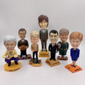 A collection of bobbleheads representing notable women in the history of women's basketball.