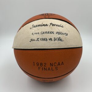 A basketball with a signature on it, showcasing the history of women's basketball.