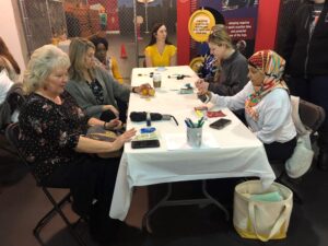 A group of people sitting at a table.