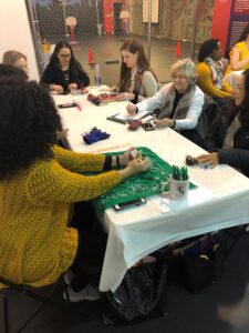 A group of women sitting around a table.