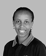 A black and white photo of a woman in a polo shirt.