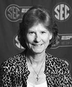 A black and white photo of a woman in front of a sec logo.