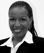 A black and white photo of a woman smiling.