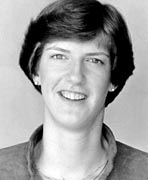 A black and white photo of a woman smiling, who is a women's basketball hall of fame member.