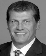 A black and white photo of a man in a suit and tie.