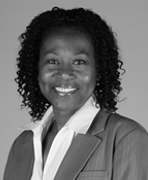 A black and white photo of a woman with curly hair.