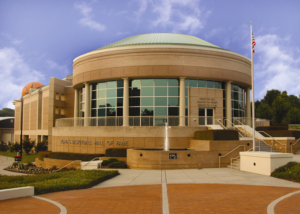 A large building with a circular dome.