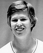 A black and white photo of a young man smiling, who is not related to the women's basketball hall of fame members.