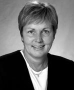 A black and white photo of a woman with short hair.