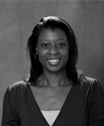 A black and white photo of a woman smiling, who is also a women's basketball hall of fame member.