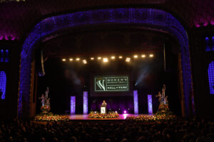 A berenson trophy stage in a large auditorium.