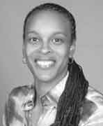 A black and white photo of a woman with dreadlocks.