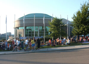 A group of people on a sidewalk.