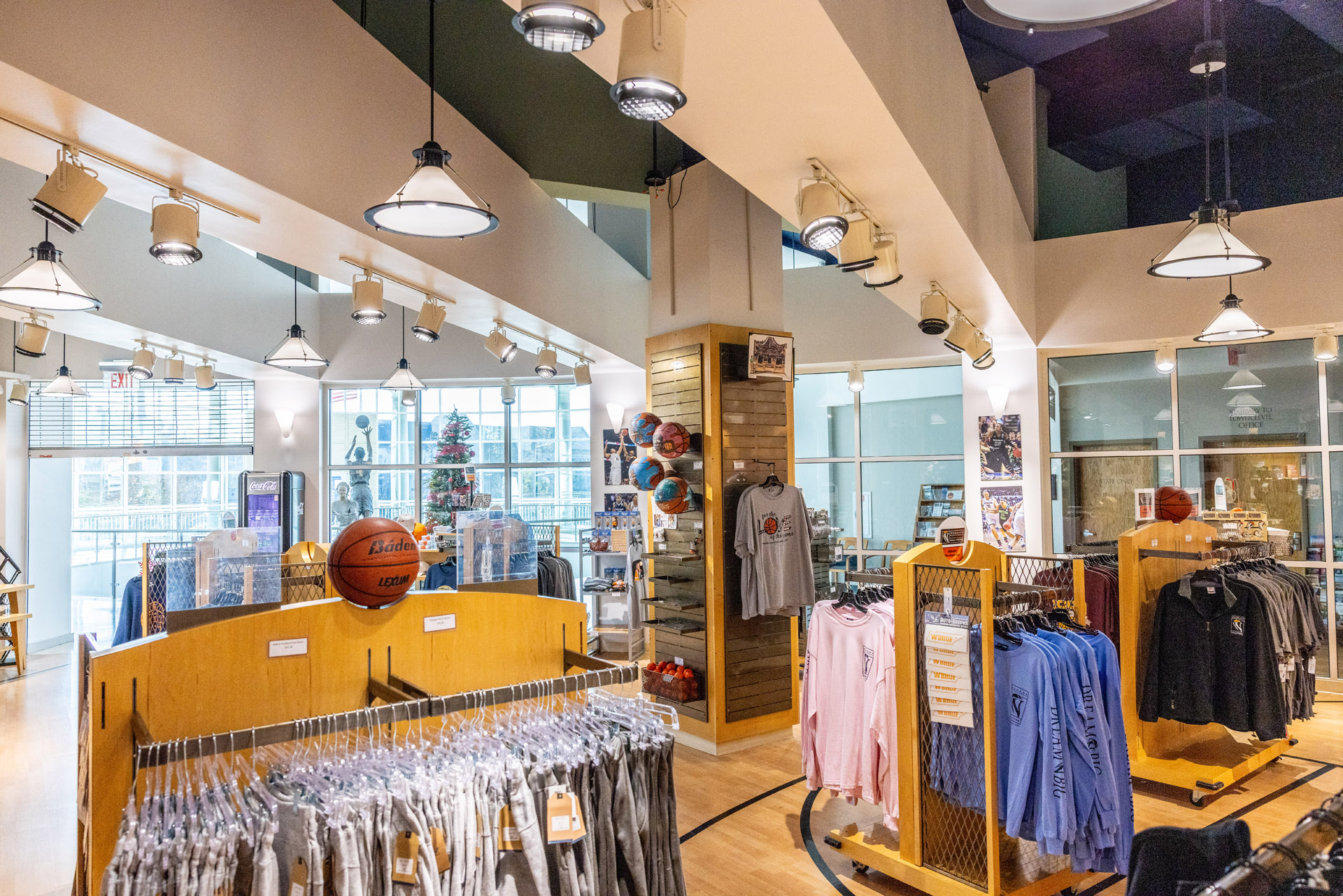 The interior of a store displaying an extensive collection of clothes.