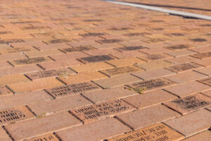 A brick walkway with many names written on it.