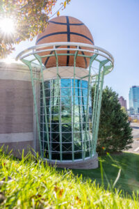 A building with a basketball on top of it.